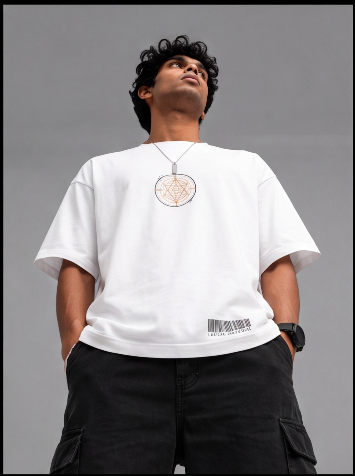 Ouffits white mythic warrior graphic oversized t-shirt — Creator & Destroyer –  A man wearing a white long-sleeve t-shirt with a circular pentagram graphic on the chest and a barcode detail near the hem, paired with black cargo pants, set against a solid gray background.
