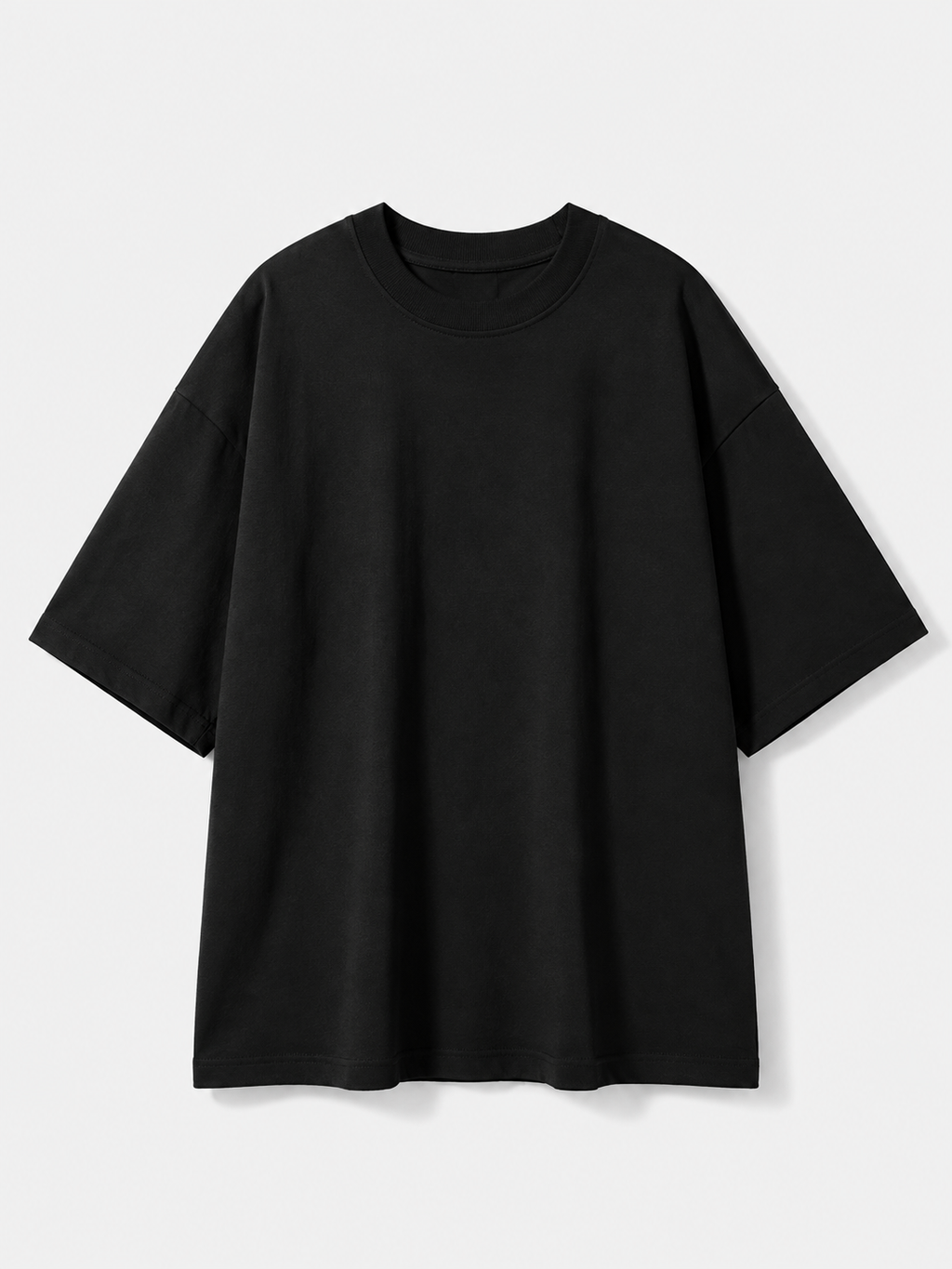 A plain black short-sleeve crewneck t-shirt with a relaxed, oversized fit, displayed against a light gray background.