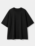 A plain black short-sleeve crewneck t-shirt with a relaxed, oversized fit, displayed against a light gray background.