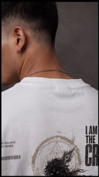 Ouffits white mythic warrior graphic oversized t-shirt — Creator & Destroyer – Person wearing a white t-shirt with graphic design and text on the back.