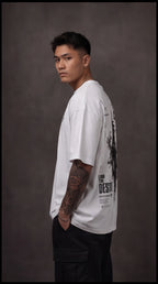 Ouffits white mythic warrior graphic oversized t-shirt — Creator & Destroyer – Person wearing a white t-shirt with graphic design on a gray background